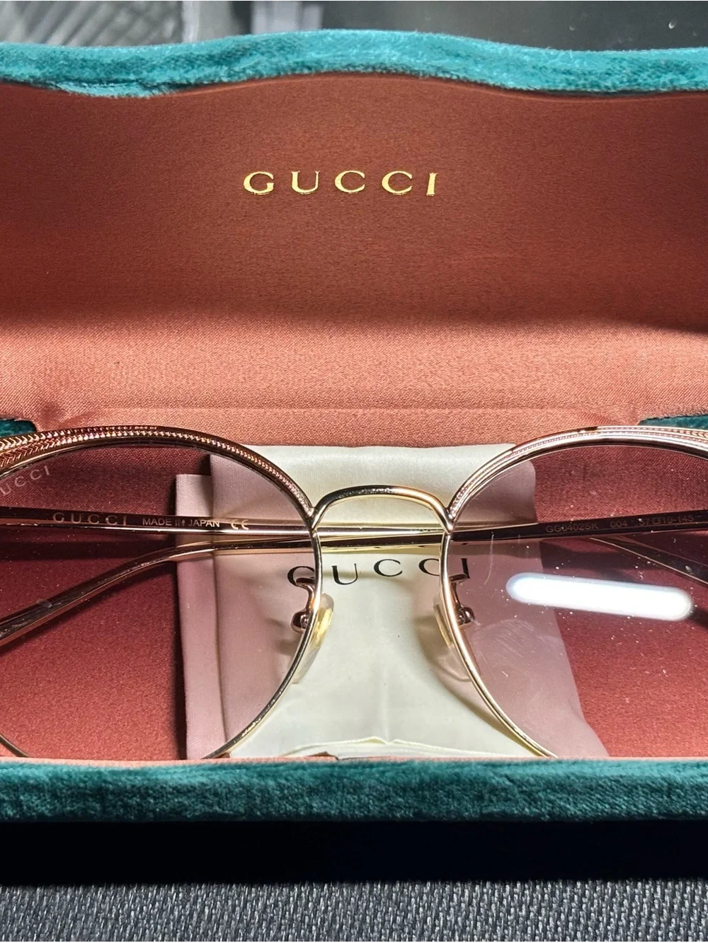Gucci Gold Frame Pink Lens Round Sunglasses
